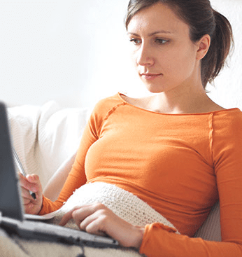 woman-using-computer-on-couch