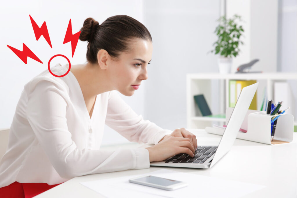 woman-straining-neck-looking-at-a-laptop-at-a-desk