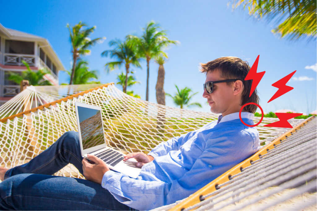 man-straining-neck-on-hammock-looking-at-a-laptop