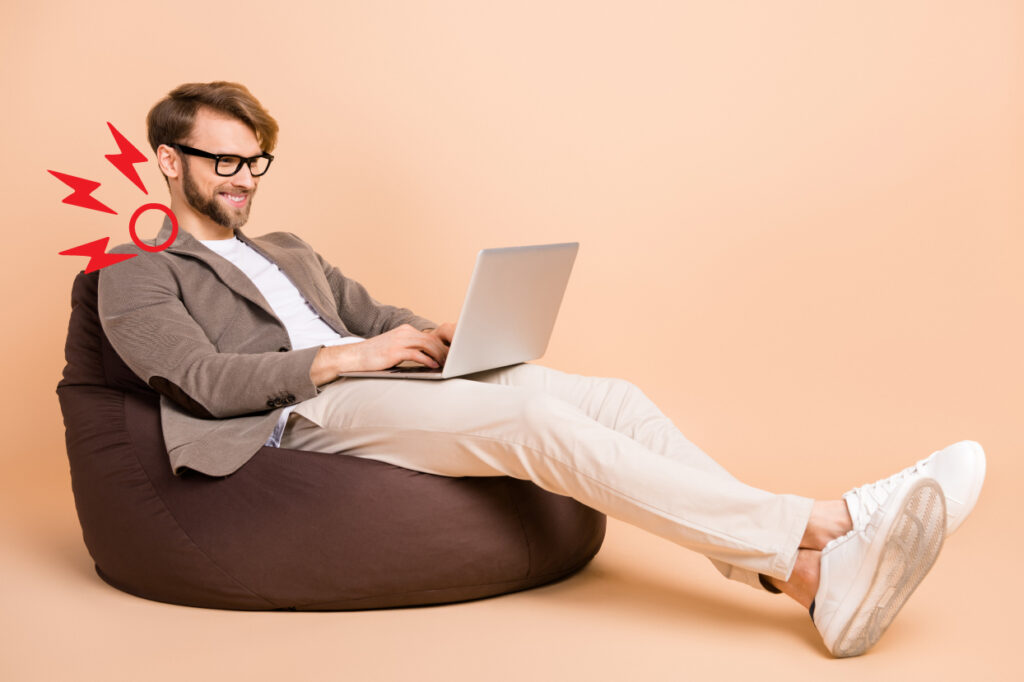 man-straining-neck-looking-at-laptop