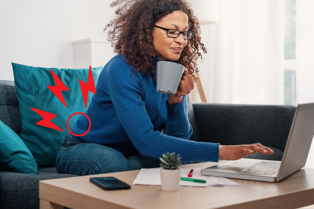 woman-straining-lower-back-by-leaning-forward-with-laptop